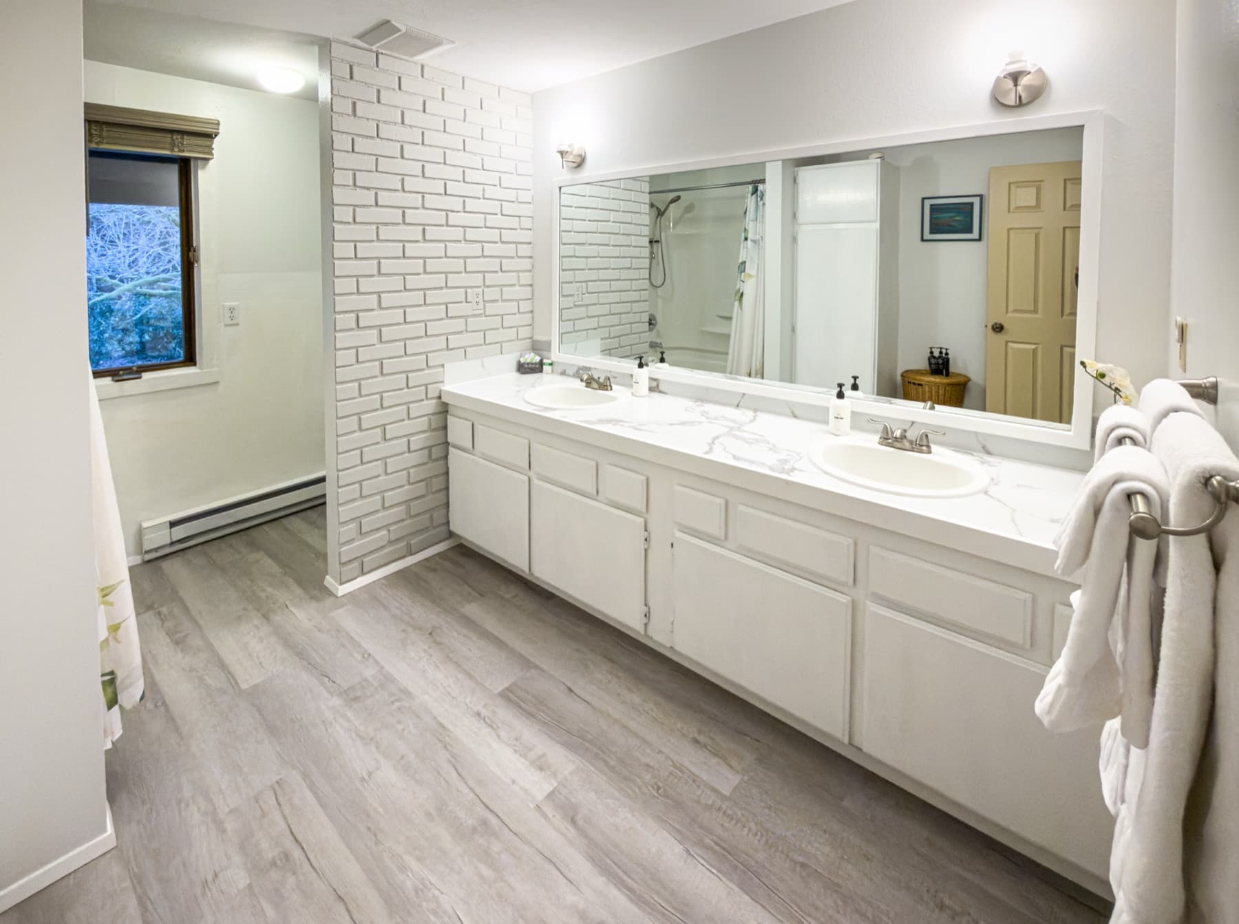 Upstairs bathroom — double vanity, white cabinetry