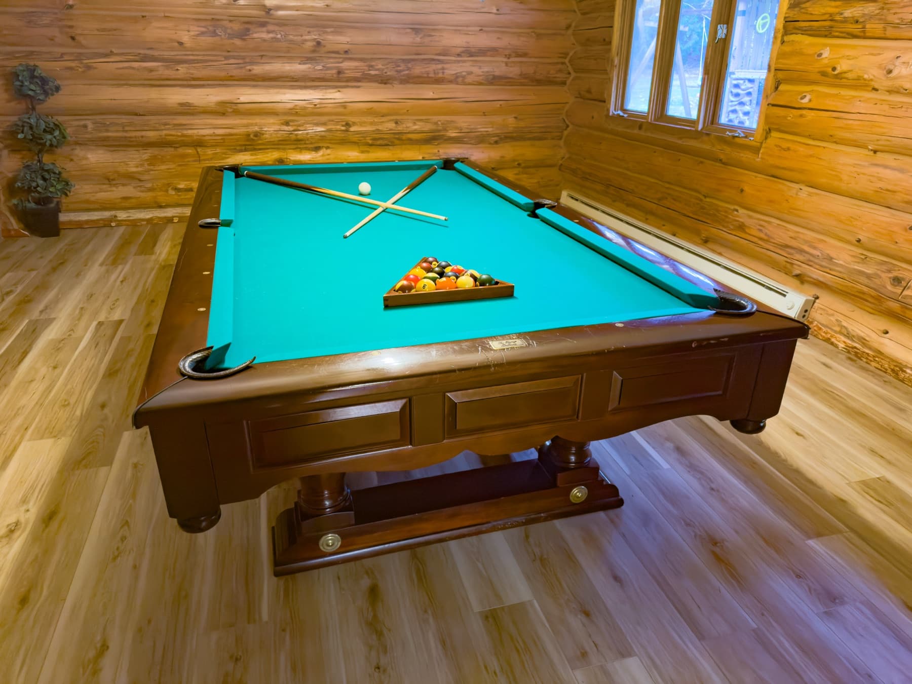Billiard room — turquoise pool table, stone fireplace