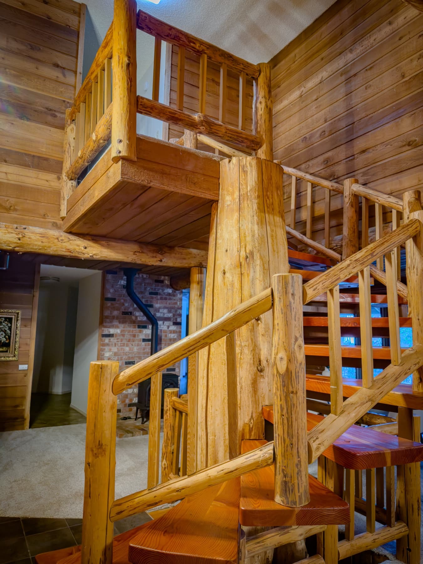 The second staircase — open railing, log construction